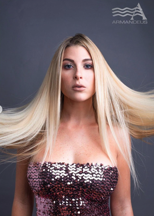 Platinum blonde and hair extensions by Salon Armandeus Doral