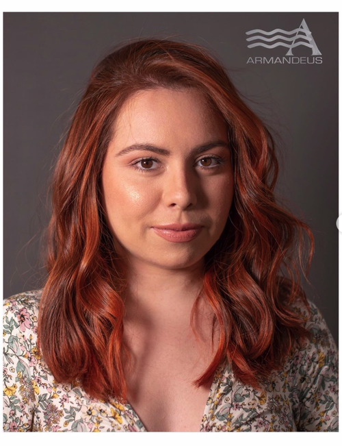 Red hair color and hairstyle by Salon Armandeus Doral