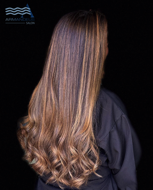 Beautiful long hair balayage style by hair salon Armandeus Katy